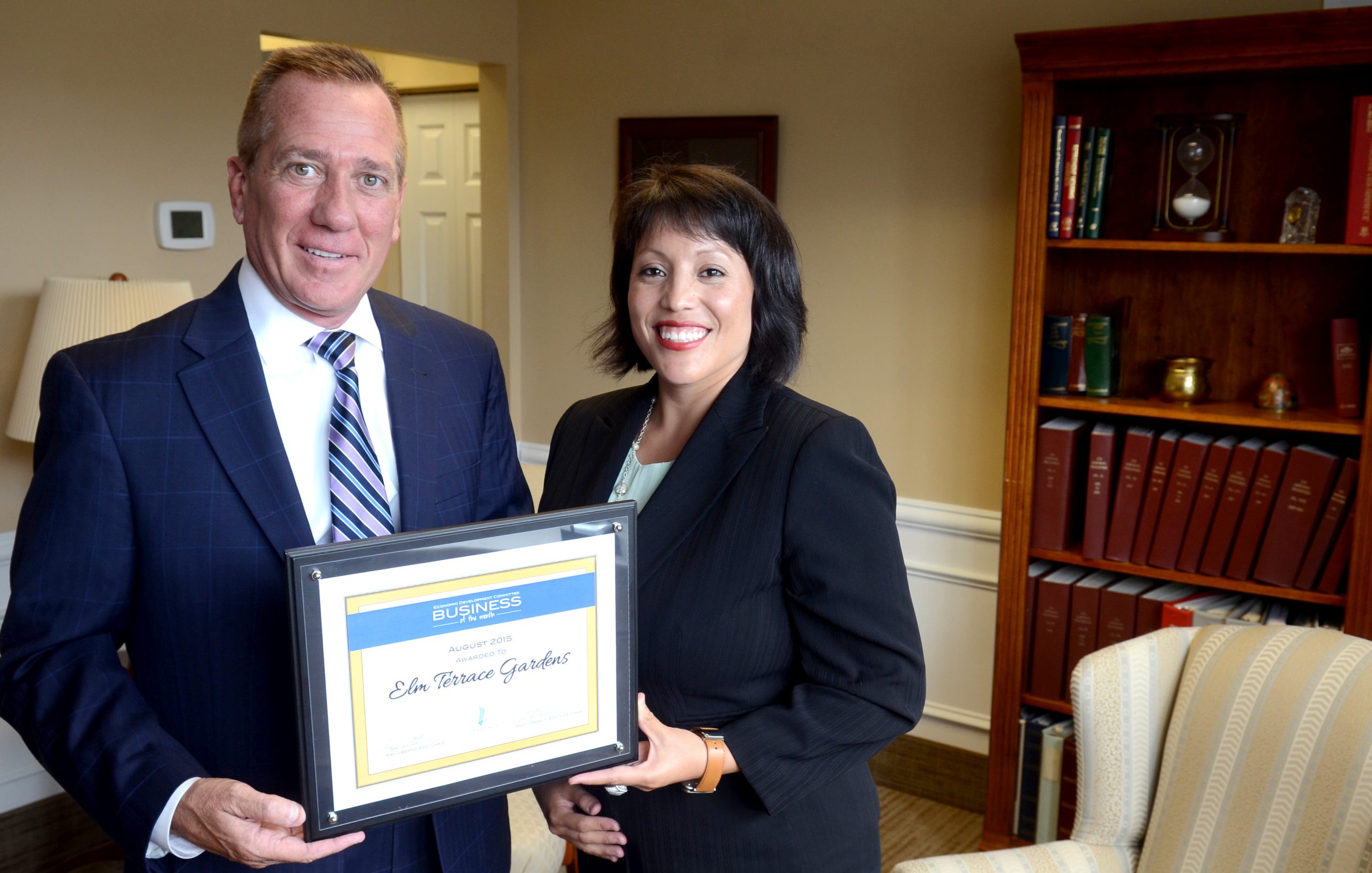 Geoff Patton--The Reporter Elm Terrace Gardens CEO Tim Murphy, left, with Traci Connelly, Director of Public Relations and Development with Lansdale's Business of the Month award for August 2015 presented by the Economic Development Committee Thurday August 20, 2015.